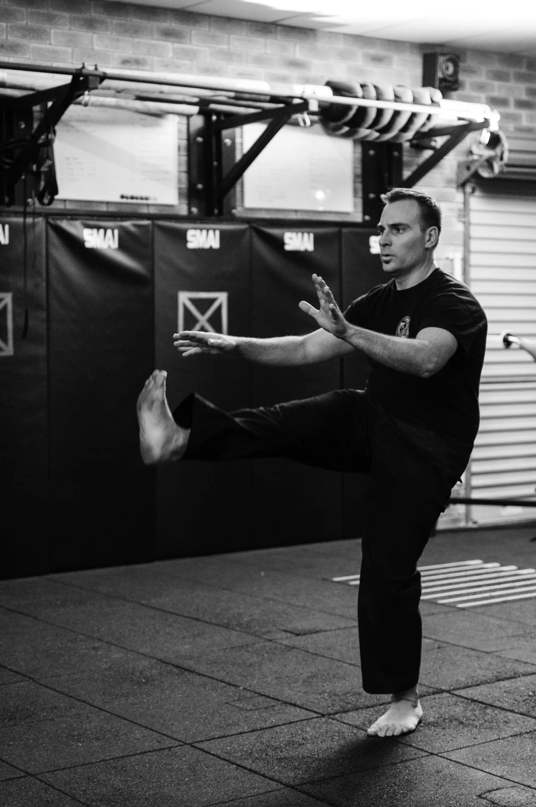 Head Instructor Grant Mundy demonstrating a controlled high leg raise