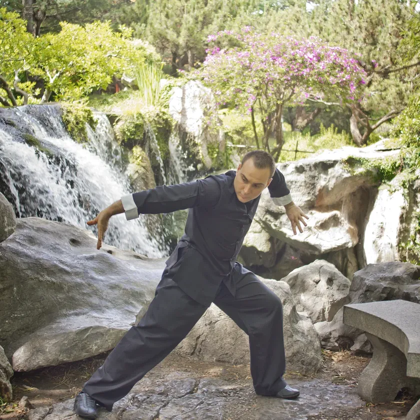 Grant Mundy performing a Baguazhang splitting palm in a Chinese garden