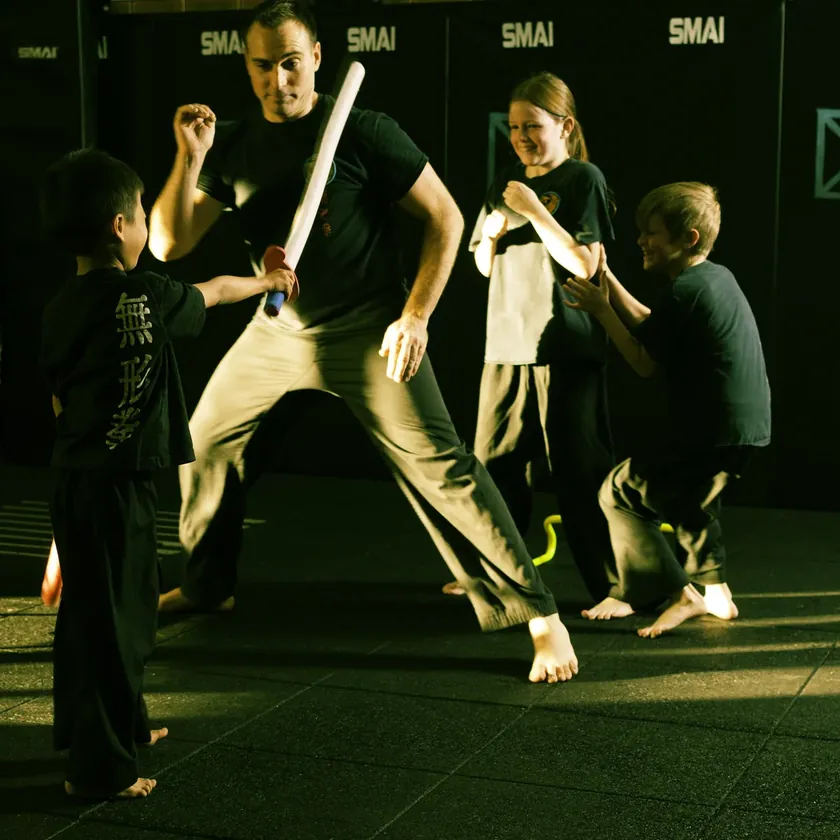 Little Dragons students playing the blind swordsman game with their instructor