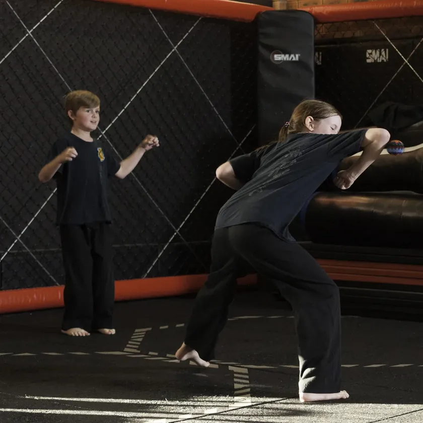 A Little Dragons student practising an inside elbow strike