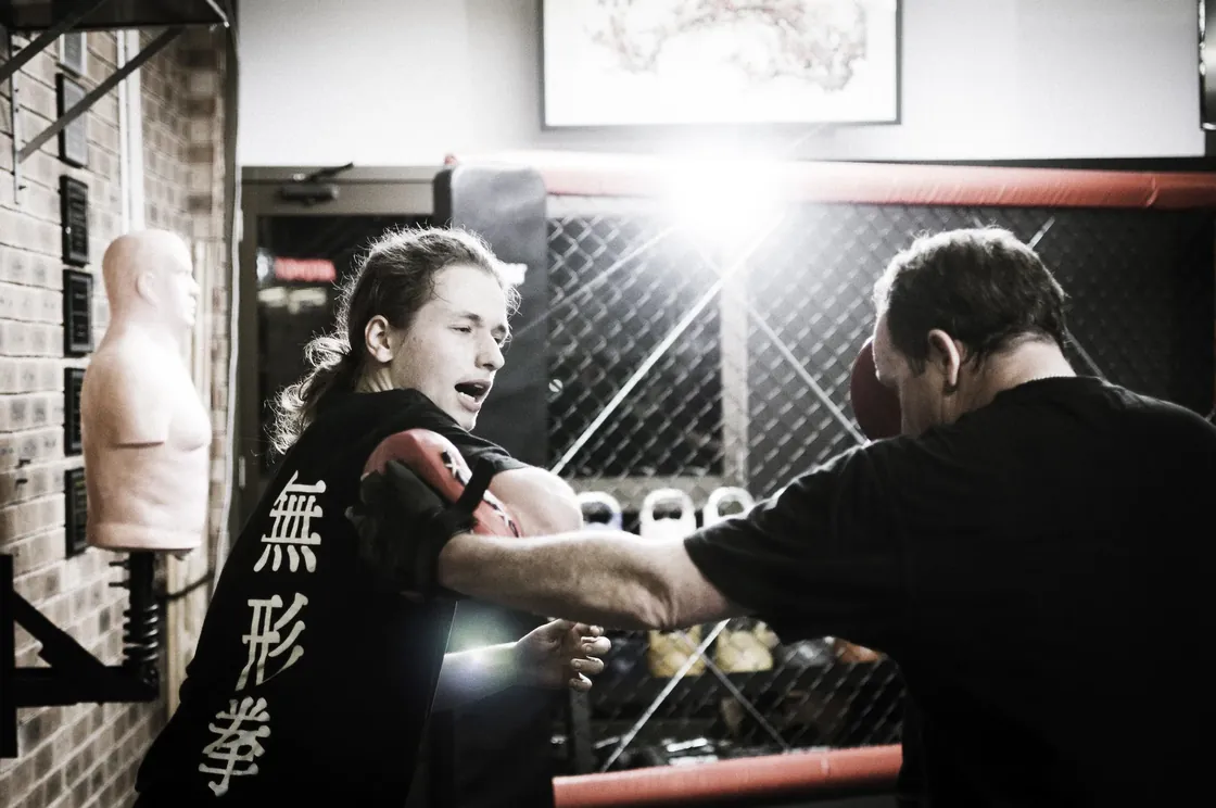 A teen student drilling elbow self-defence with Head Instructor Grant Mundy