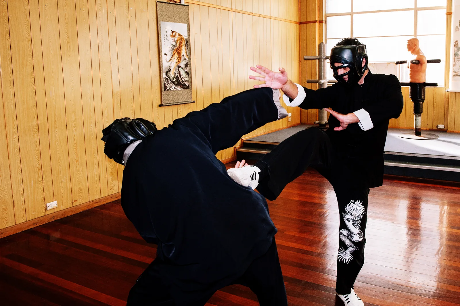 A kick during headgear sparring in the kung fu school.