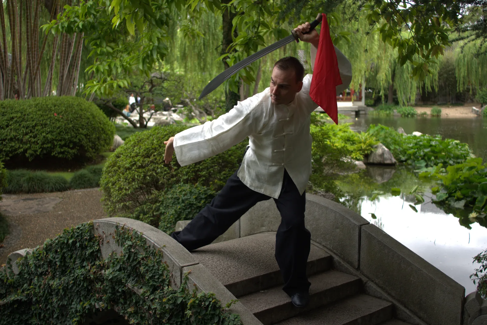 Broadsword form on a Chinese garden bridge.