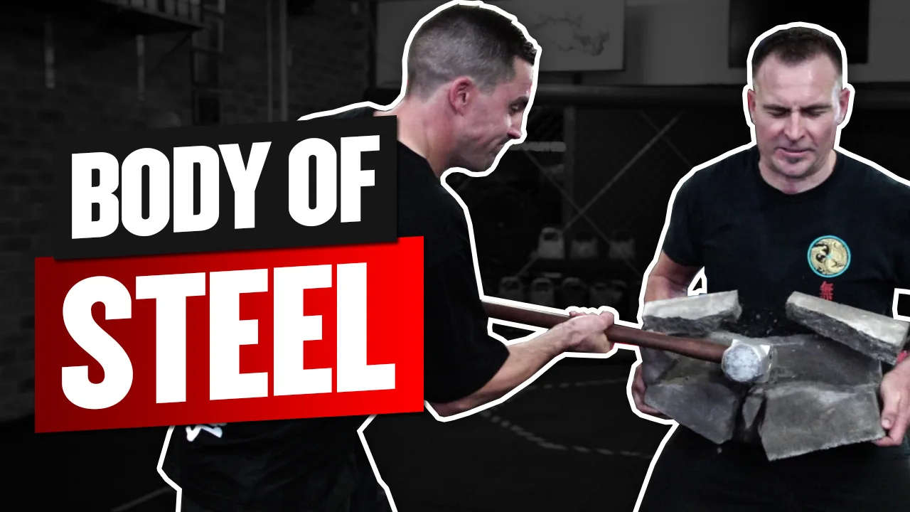 Two men in a dark gym smash concrete blocks with a steel bar; bold text reads BODY OF STEEL.