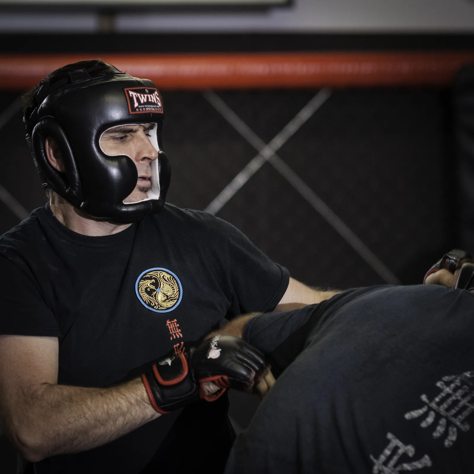 Close-up of a student wearing protective headgear and gloves.