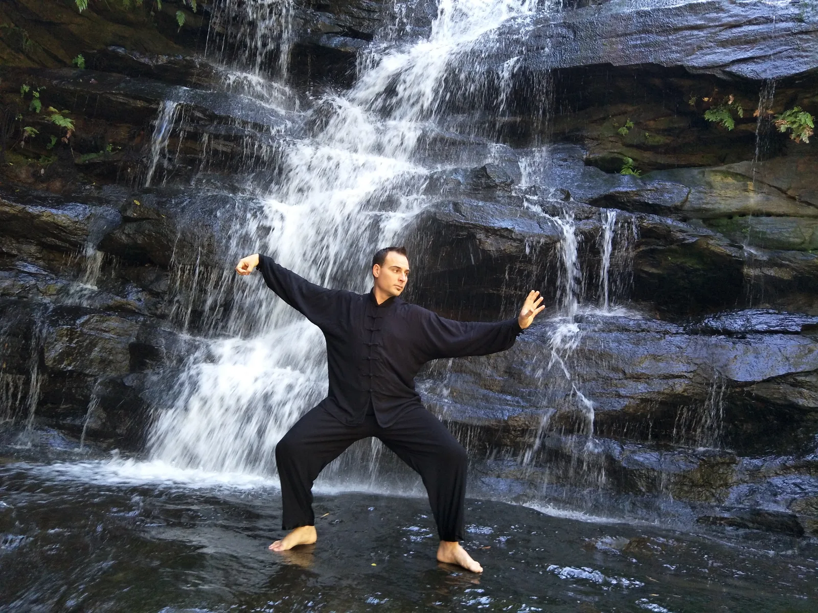 Qigong warm-up beneath the waterfall at Somersby Falls.