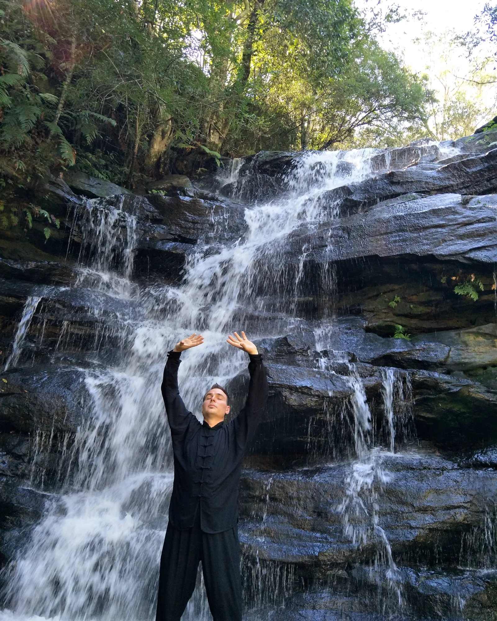 Qigong in front of the waterfall at Somersby Falls.