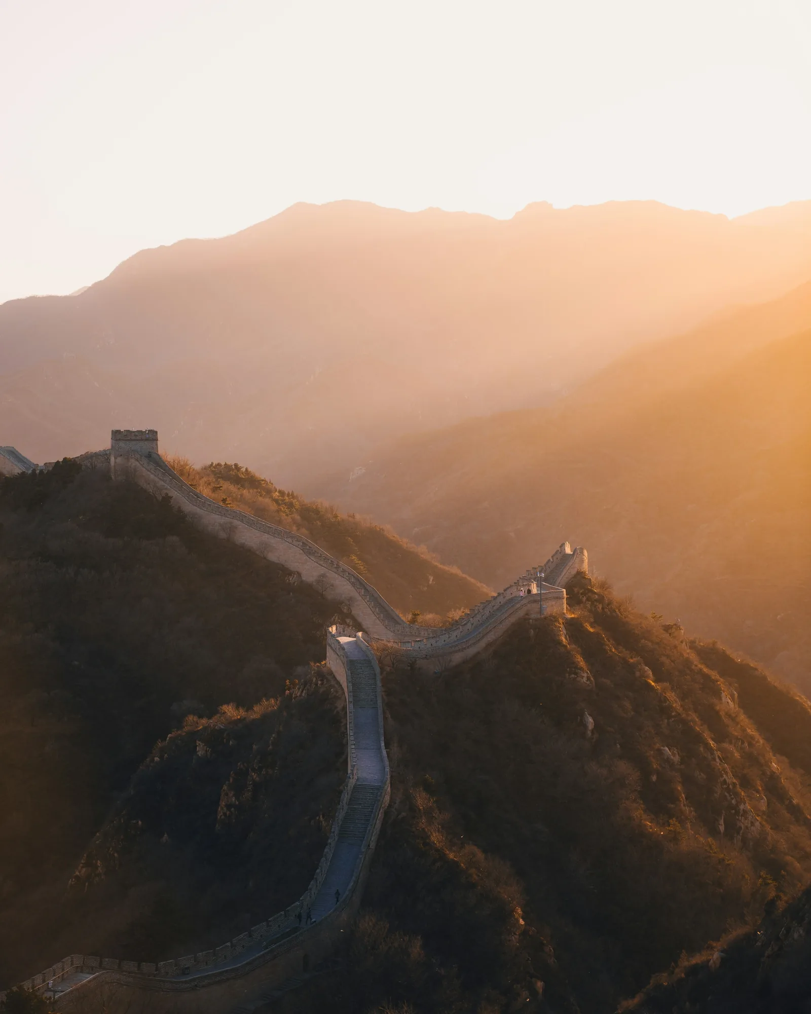 The Great Wall of China winding over the mountains.